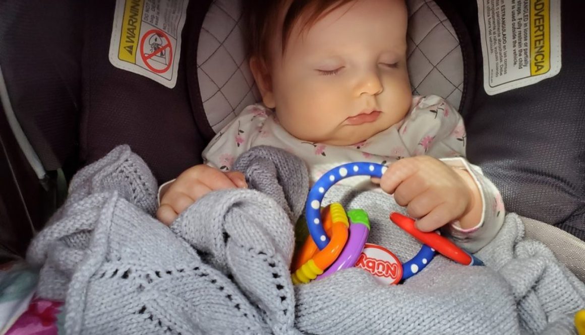 Baby sleeping in car seat